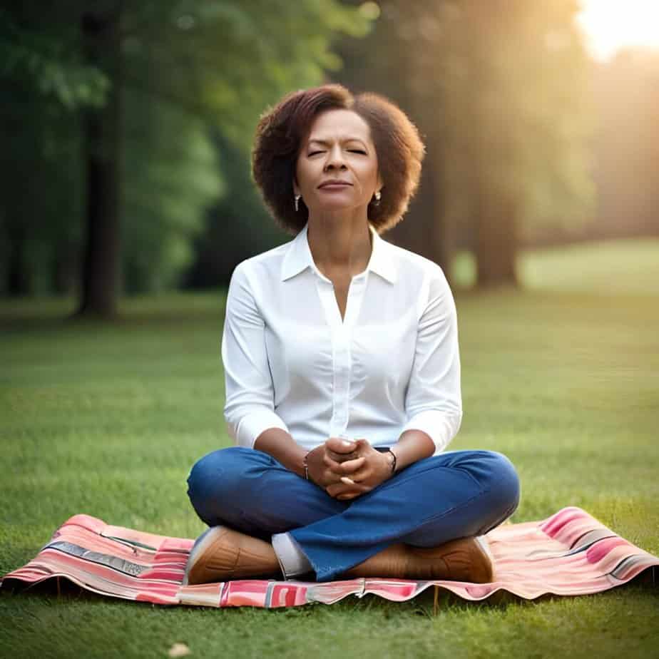 Over 40 years old woman meditates in a park