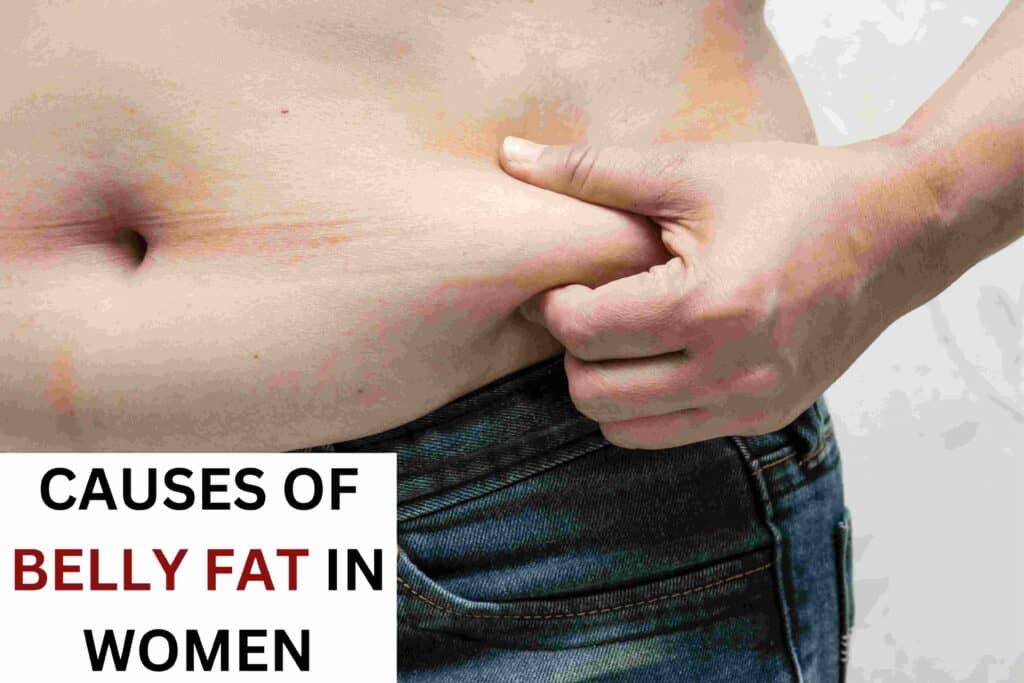 A woman holds the fat around her belly