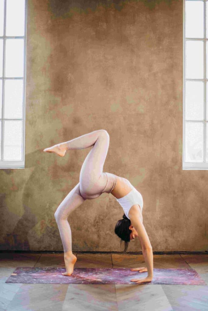 A lady practices backbend pose