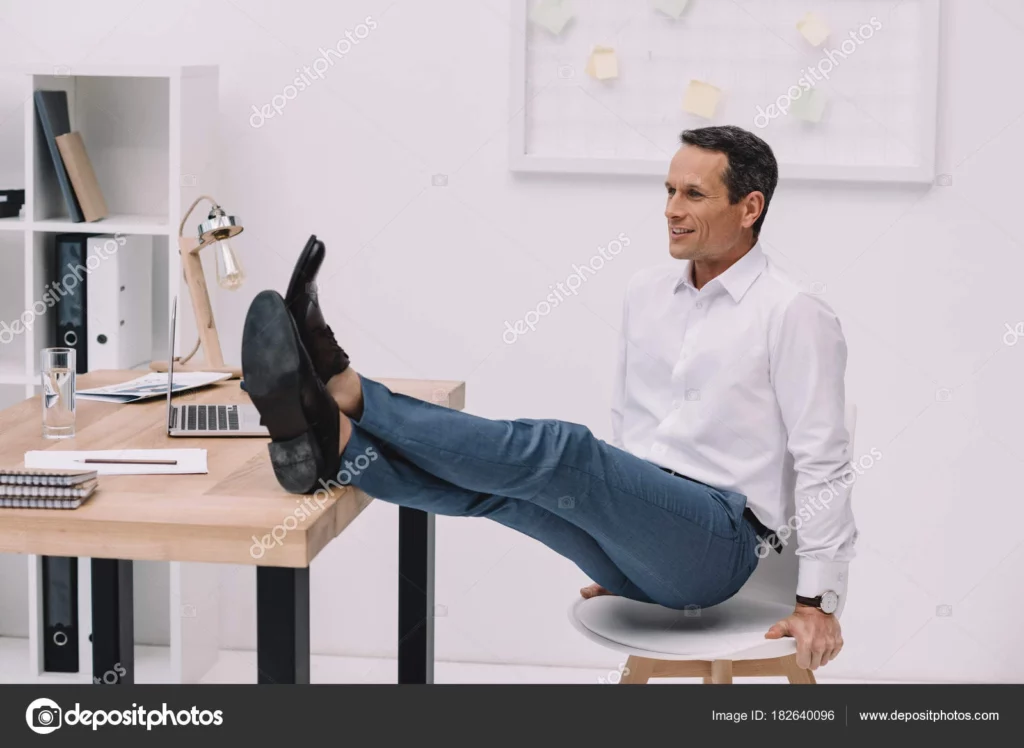 Man exercises in his office