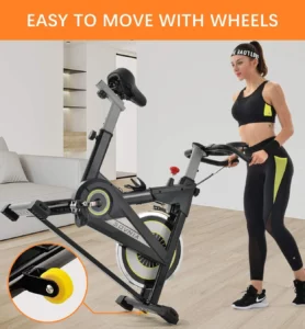 Lady rolls the Sovnia Indoor Cycling Exercise Bike to a storage area