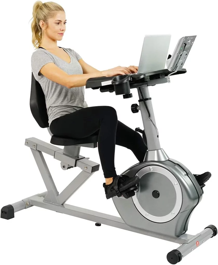 A woman exercises on the Sunny Health & Fitness SF-RBD4703 Convertible Recumbent Bike