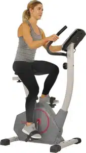 A woman exercises on the Sunny Health & Fitness SF-B2952 Upright Bike