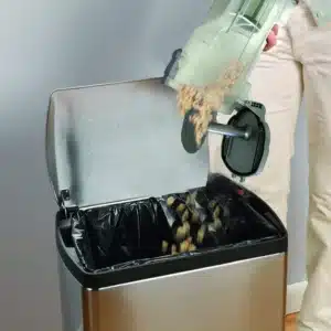 The pulp of fruits and vegetables being disposed into a bin